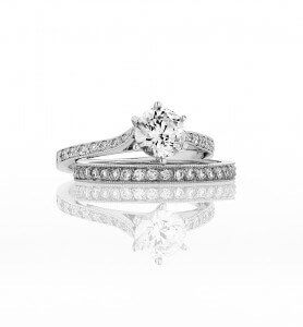 Kush Diamonds handcrafted Elizabeth style engagement ring featuring matching diamond wedding band 